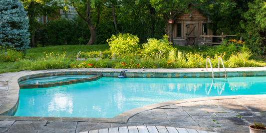 Family enjoying an inground pool in a residential backyard during regular use