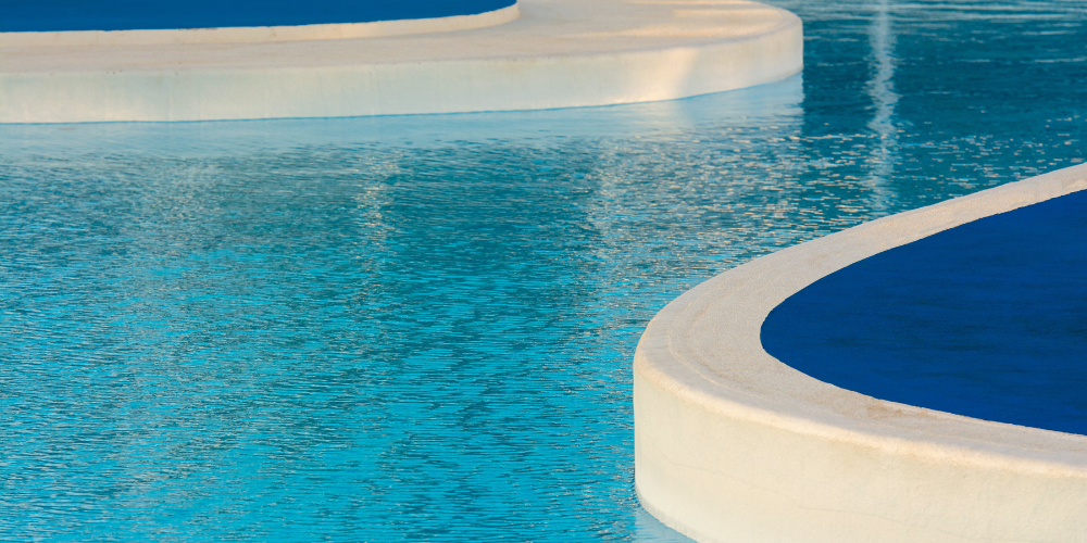Backyard inground pool at a residential home representing long term pool ownership costs