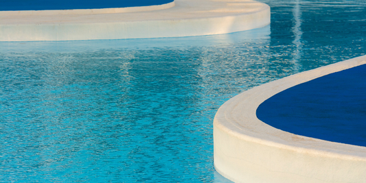 Backyard inground pool at a residential home representing long term pool ownership costs